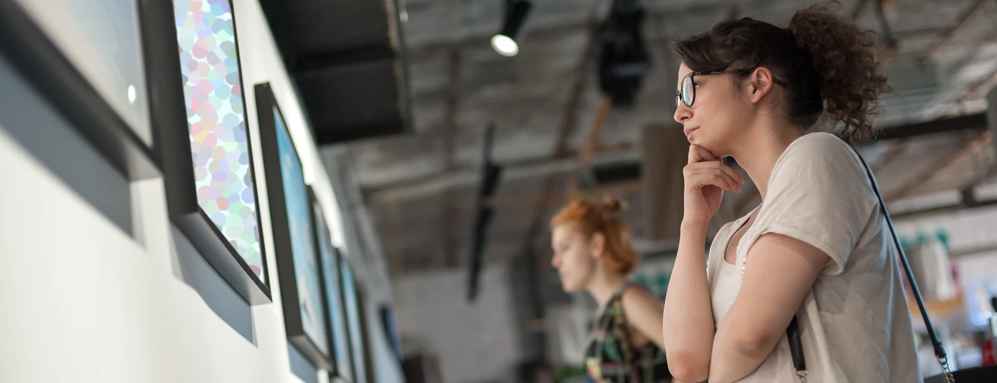 Visitors viewing artwork in a contemporary art gallery