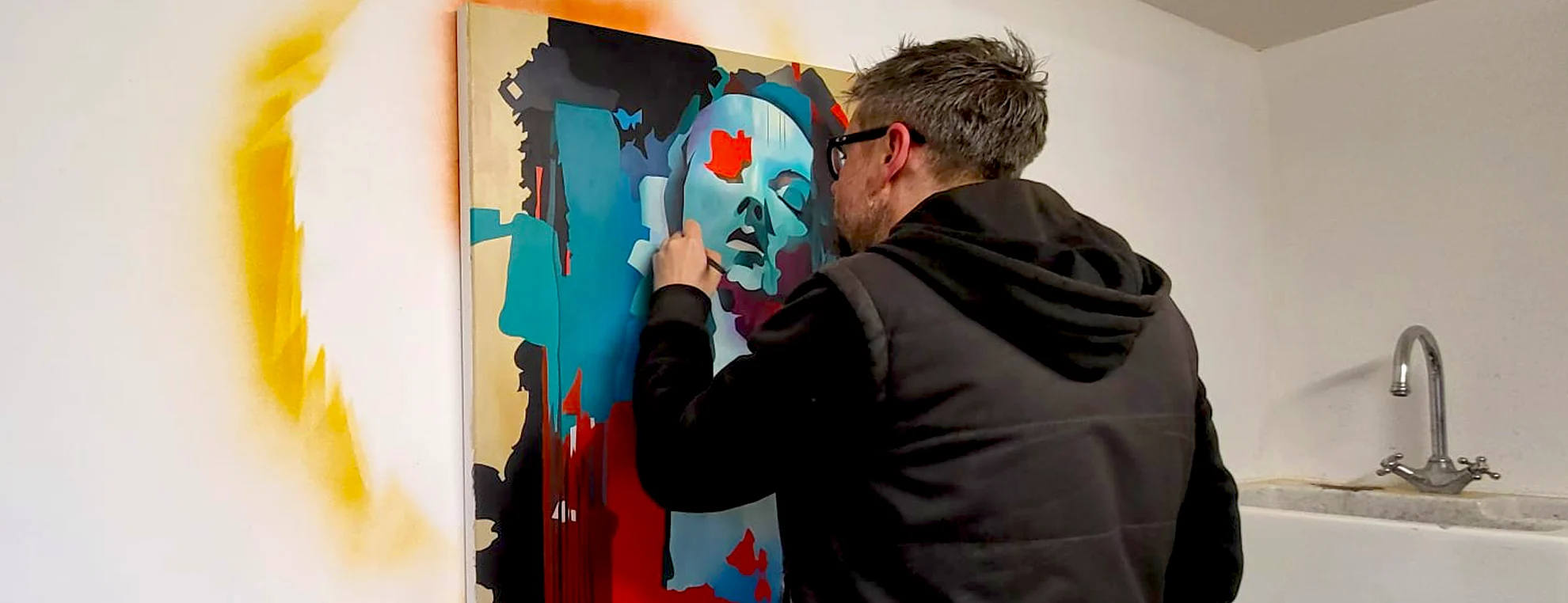 Paul Kneen working on abstract portrait painting in studio showing detailed painting process and layered colour